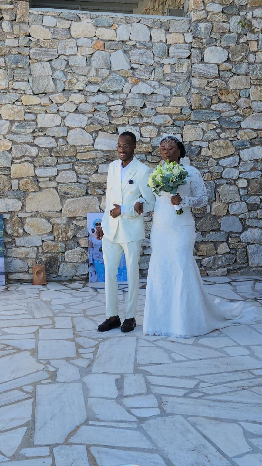 Bride and groom with wedding party at a stone venue