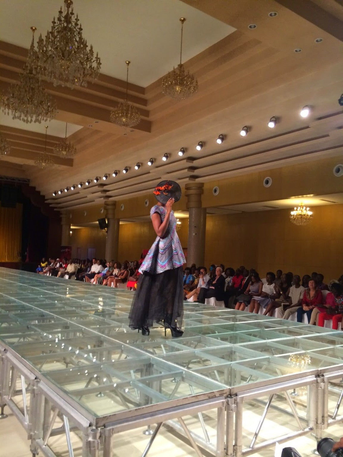 Runway model in a sculptural chevron look at Nigeria Fashion Week