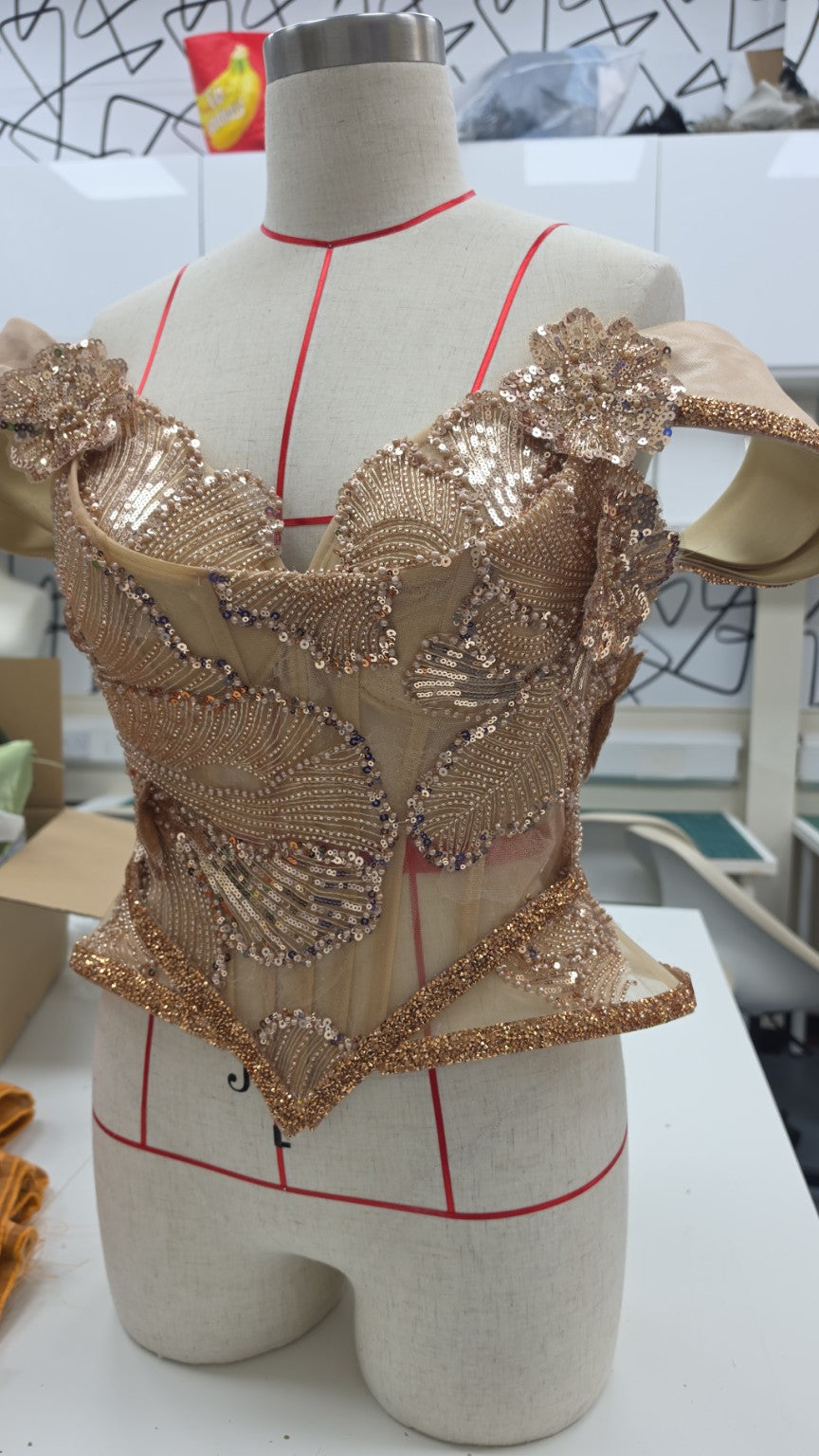 Beaded couture corset on a dress form