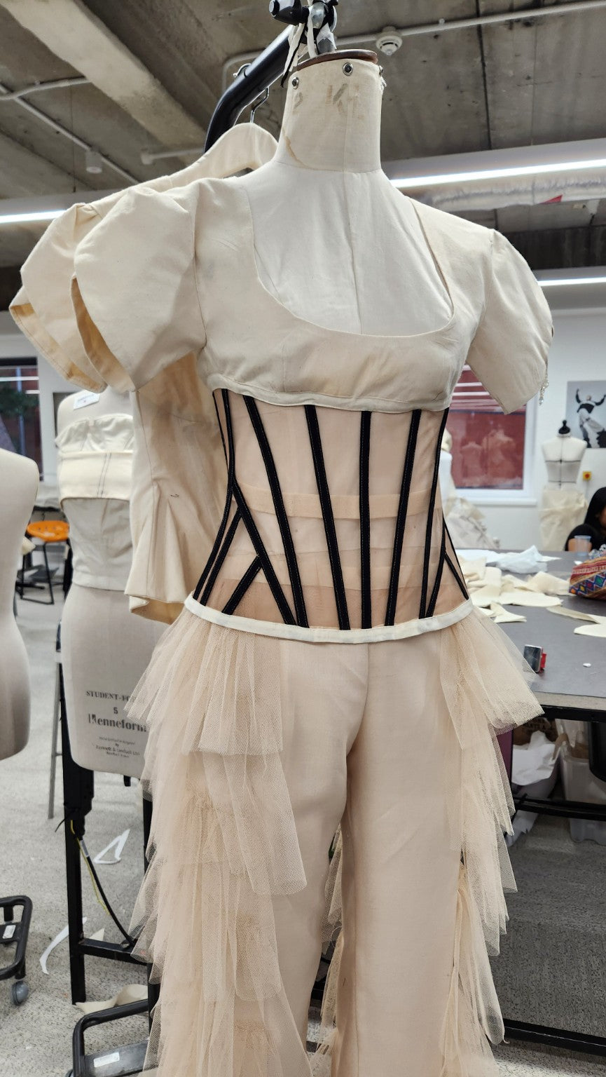 Corseted toile and tulle design development on mannequin