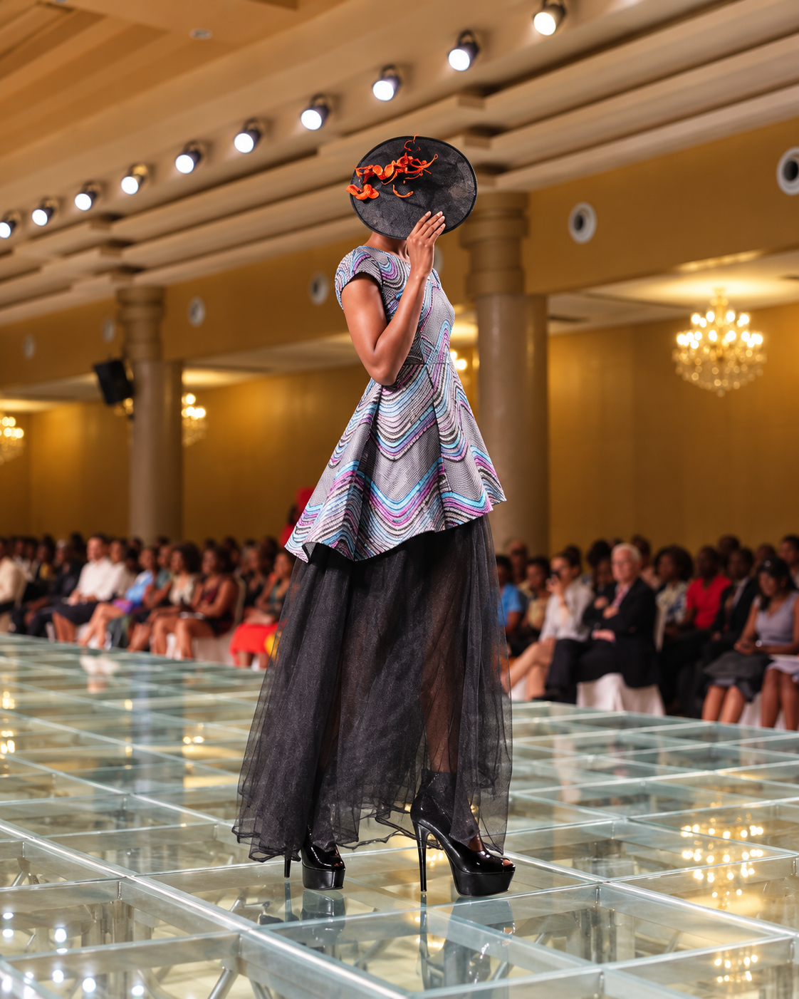 Runway model in a sculptural printed look at Nigeria Fashion Week