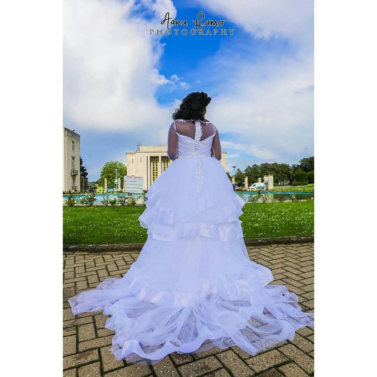 Back view of a white tiered wedding gown