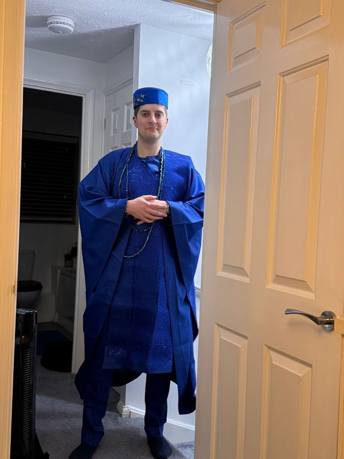 Blue ceremonial menswear documented before an event