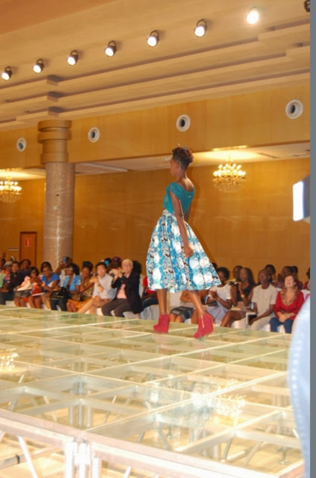 Runway model in a blue printed look at Nigeria Fashion Week