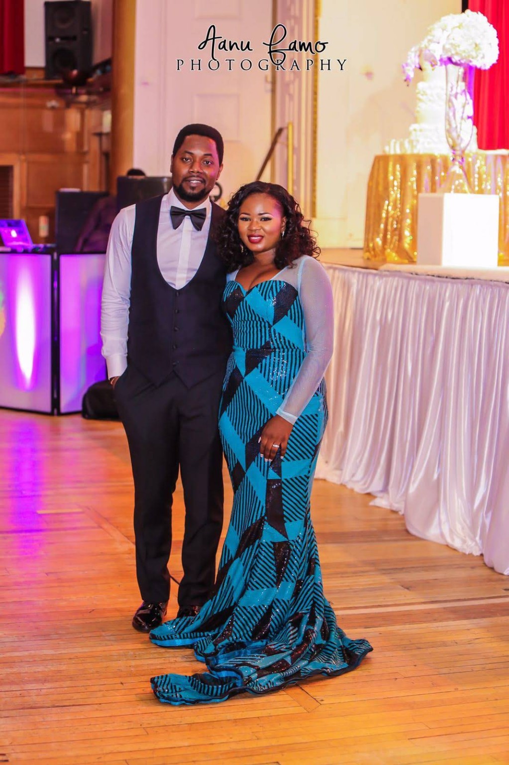 Client in a teal floor-length occasion gown