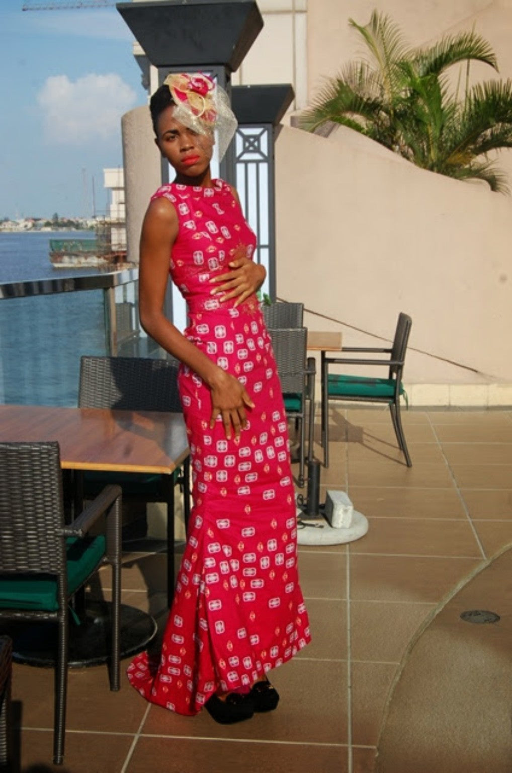 Fuchsia printed gown photographed by the waterfront