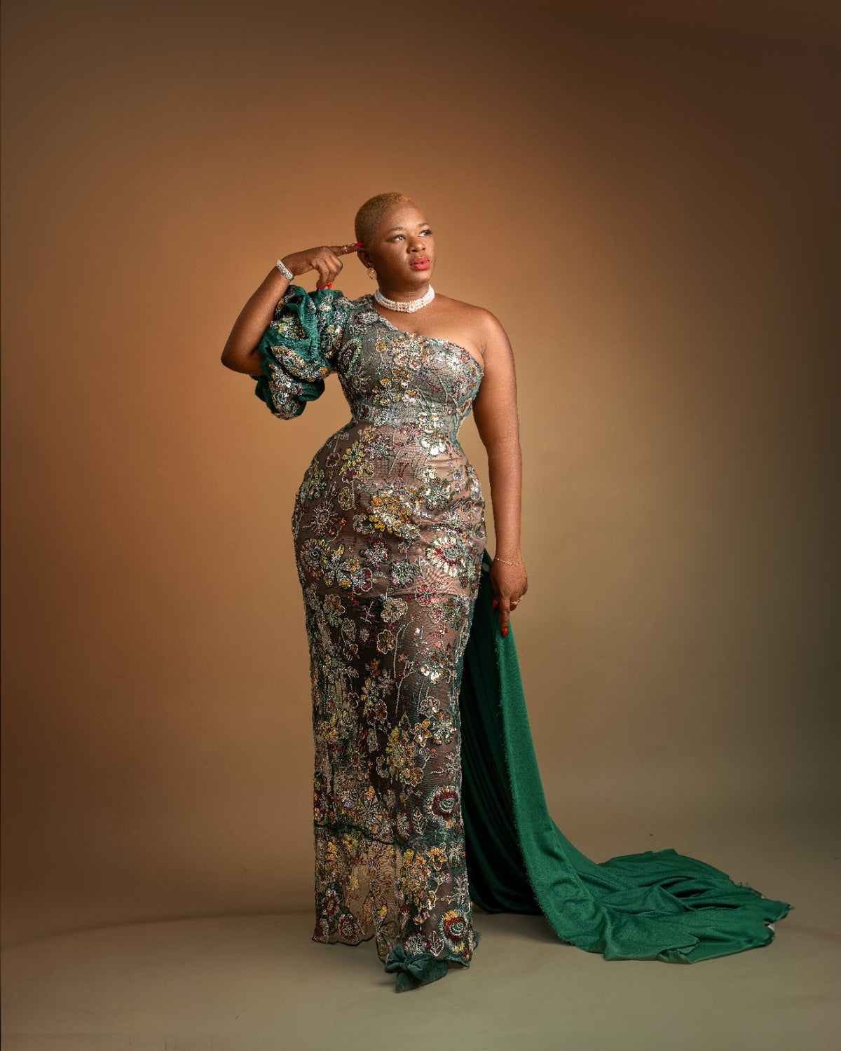 Green embellished occasion gown with train