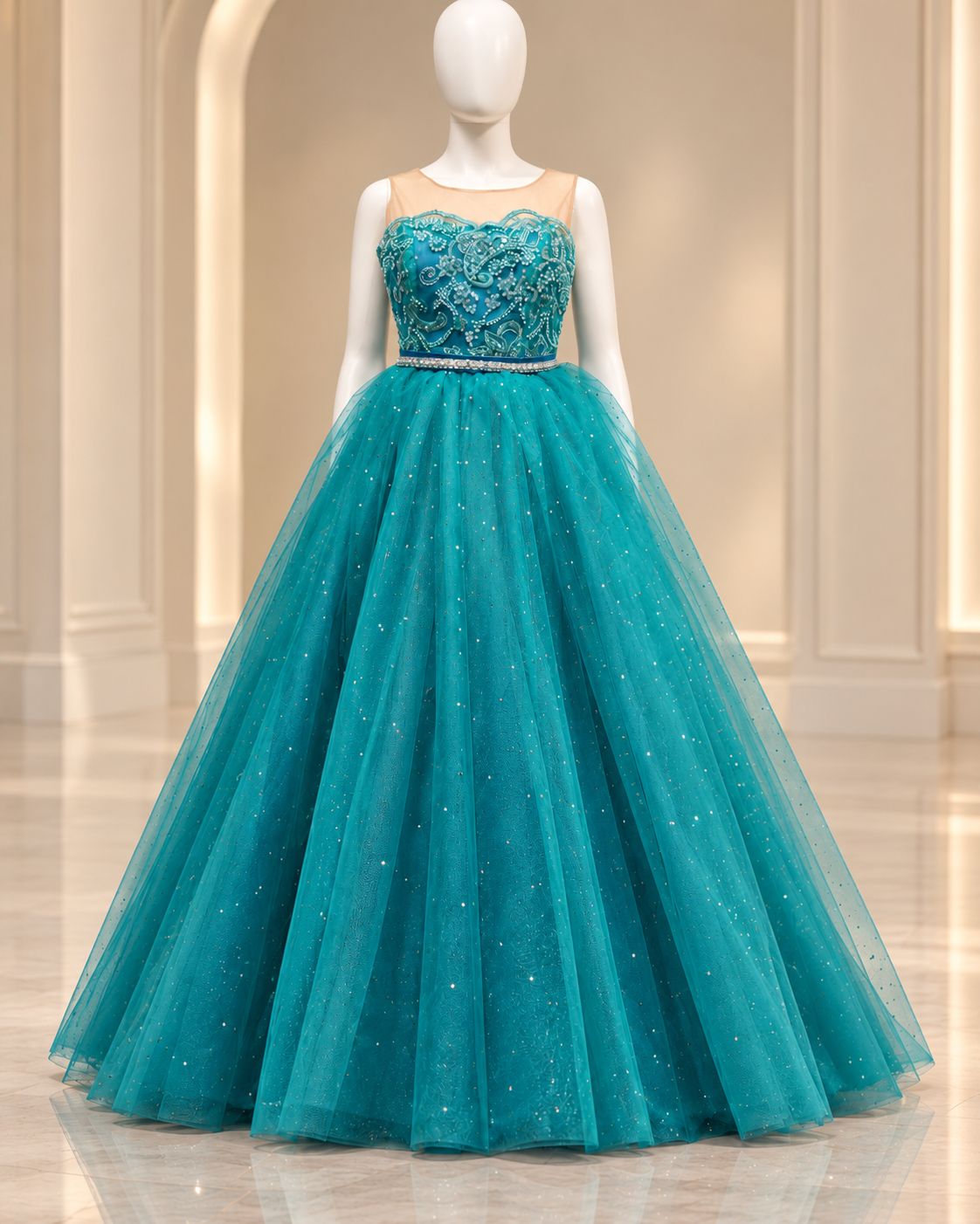 Teal beaded occasion ball gown on mannequin in a clean atelier setting