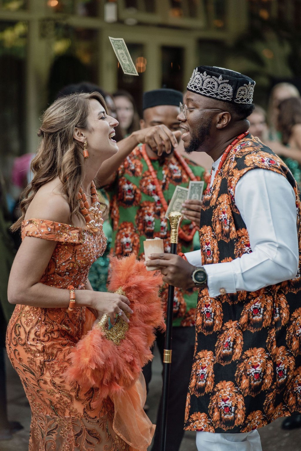 Wedding couple in coordinated orange occasionwear